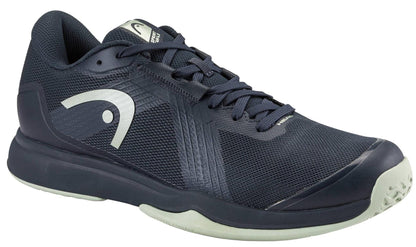 The HEAD Sprint Team 4.0 Men's Tennis Shoes in Navy/Cantaloupe Green feature a breathable textured mesh upper, a white HEAD logo on the side, and a light sole—perfect for both sports and casual wear.