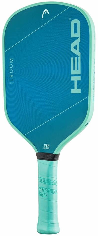 The HEAD Boom XCEED 2026 Pickleball Paddle by HEAD features a blue and teal design with "HEAD" and "BOOM" on the face, a textured fiberglass composite surface, and a cushioned ridged handle for excellent grip.