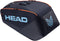 The HEAD Pro 9 Racket Tennis Bag L - Navy by HEAD features orange zippers, a large light blue "HEAD" logo, an abstract symbol, a top handle, and a sleek angular design inspired by the Jannik Sinner tennis bag.