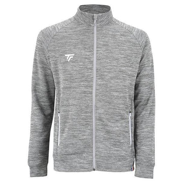 The Tecnifibre Men's Team Tennis Jacket - Silver is a lightweight and breathable design featuring long sleeves and a high collar. Made from stretchy polyester double mesh fabric for a textured look, it includes white zippered pockets on both sides and sports a subtle logo on the left chest.