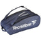 The Tecnifibre Tour Endurance 2023 12 Racket Tennis Bag in navy blue, crafted from durable tarpaulin material, showcases a striking design with dual handles and a zippered compartment. The Tecnifibre brand name and logo are prominently displayed in white on the side.