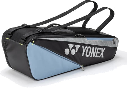 The Yonex BA52526EX Club 6 Racket Tennis Bag in Black/Blue features two shoulder straps, a light blue front pocket, gray top section, white Yonex logo, and dedicated racket storage—ideal for tennis players on the go.