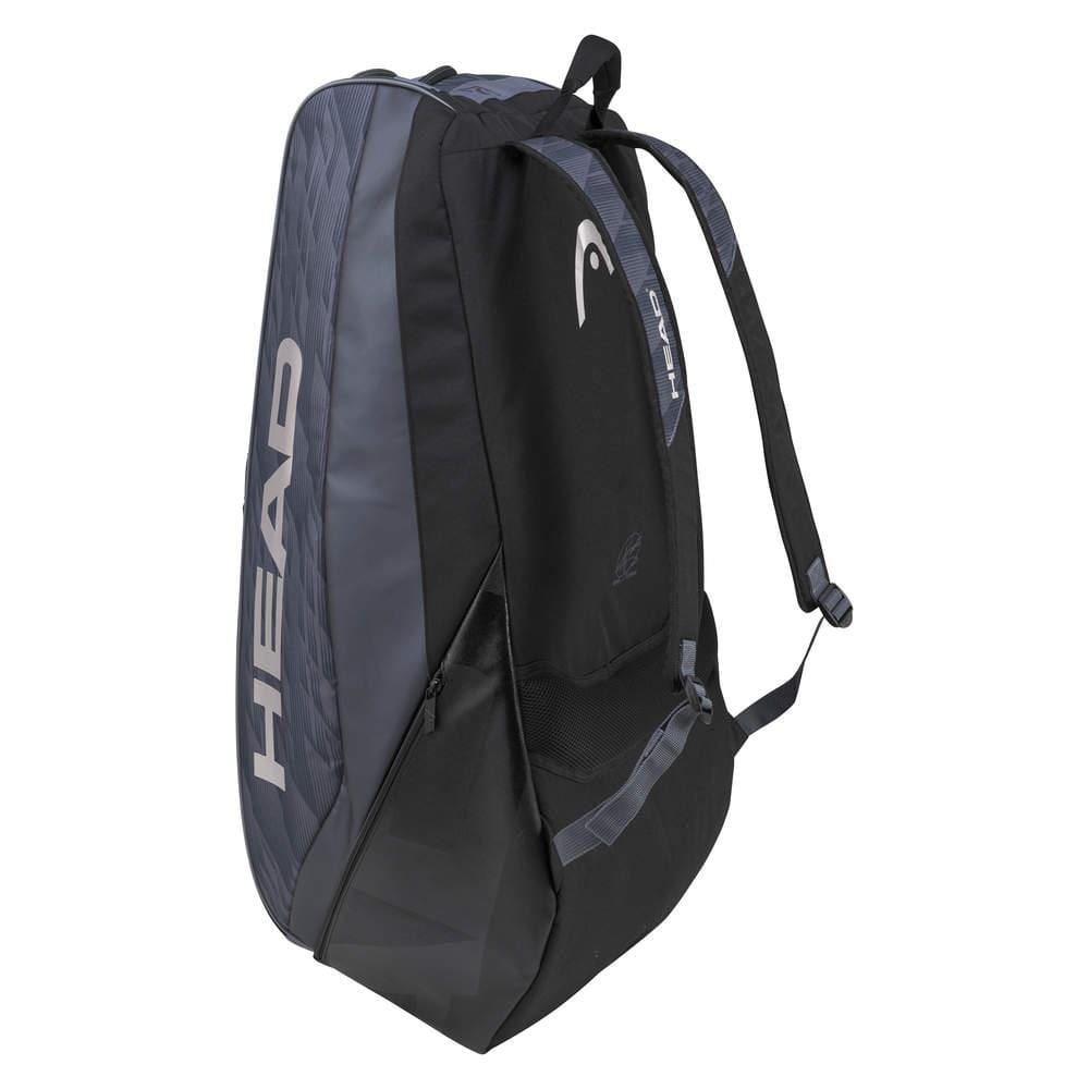 The HEAD Djokovic Monstercombi 12R Tennis Racket Bag in Anthracite and Black showcases "HEAD" in bold white lettering on the side. Inspired by Novak Djokovic, this bag includes multiple compartments, adjustable shoulder straps, and innovative CCT+ climate control technology to safeguard your gear.