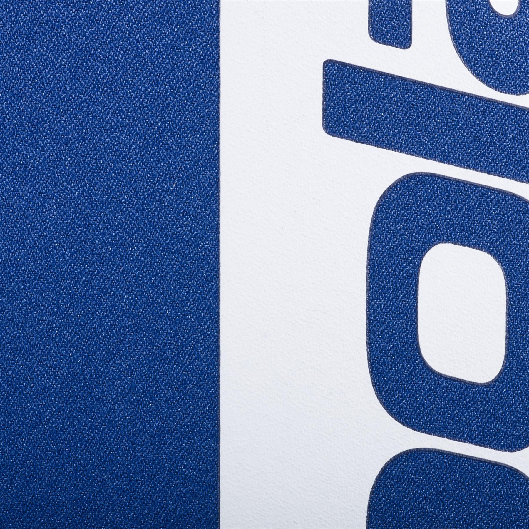 Close-up of the Babolat Court Hero Tennis Backpack in dark blue, showing its textured, recycled PET surface and bold navy blue letters along the right edge.