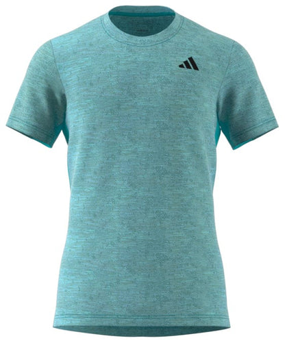 This blue ADIDAS Men's Freelift Tennis T-Shirt incorporates AEROREADY technology and showcases a small black adidas logo on the left chest, providing both style and comfort for every serve.