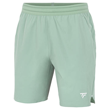 Tecnifibre Team Stretch Men's Tennis Shorts in sage green feature an elastic waistband and a small white logo on the lower left leg. These shorts offer a sleek, clean design and are set against a white background.