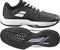The Babolat Jet Tere 2 All Court Men's Tennis Shoes in Black/White are shown from the side and bottom, highlighting their ultra-lightweight design, textured sole with bold tread patterns, and white accents on the upper and sole.