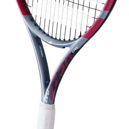 Close-up of the Babolat Evo Aero Lite Pink 2026 Tennis Racket, featuring a lightweight grey and pink frame, white grip, and tightly strung strings—showcasing Babolat’s agile design.
