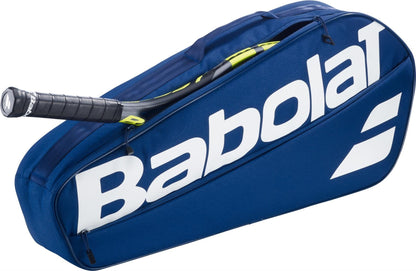 The Babolat Court XS 3 Racket Tennis Bag - Blue displays a large white Babolat logo and features a partially unzipped design with a racket handle visible, offering a stylish and compact way to carry your gear.