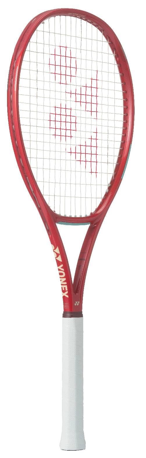 The Yonex VCORE Play Ruby Red 2026 Tennis Racket, featuring ISOMETRIC technology and a white grip with a red logo, stands upright against a white background—ideal for beginner players.