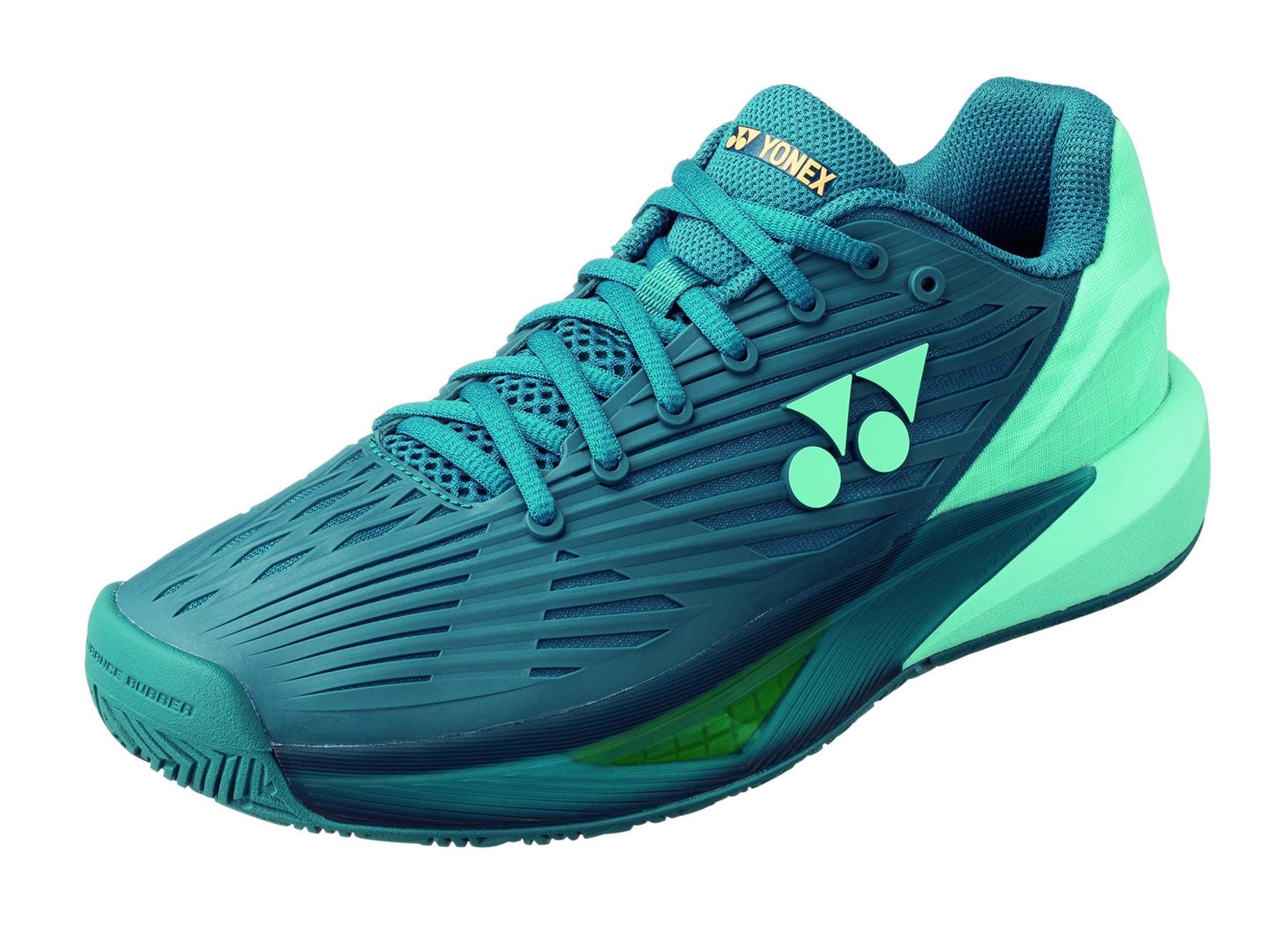 The Yonex Power Cushion Eclipsion 5 Men's Tennis Shoes in blue-green offer a unique design with a patterned upper, a thick sole, and the Yonex Power Cushion for outstanding shock absorption, finished with the brand's logo near the laces.