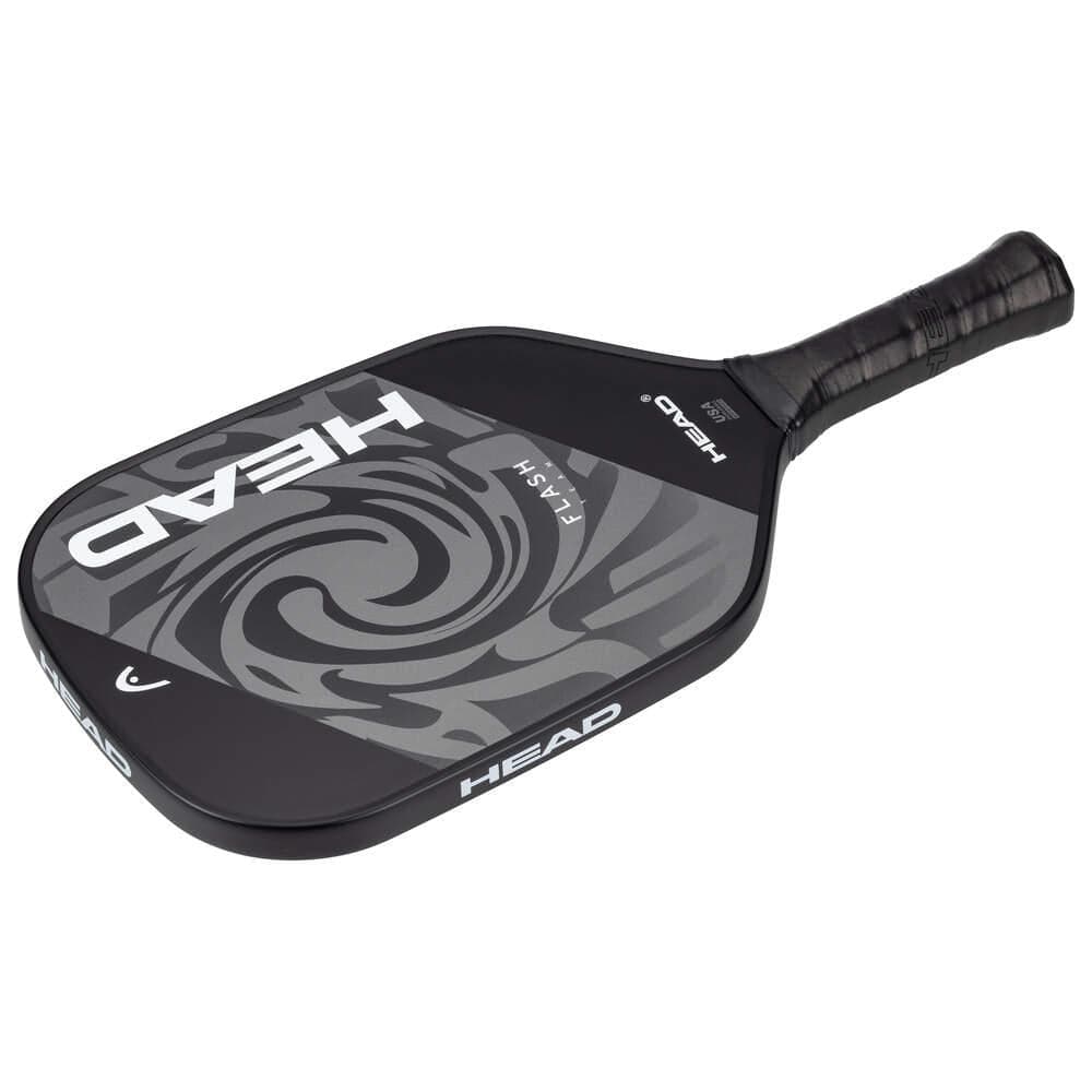 The HEAD Flash Team Pickleball Paddle in Black/Grey features a swirling pattern, bold white "HEAD" lettering, and an ergonomic handle with black grip tape—perfect for beginners seeking comfort and control.