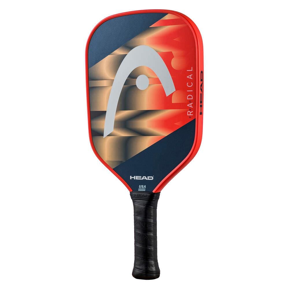The HEAD Radical Pro Pickleball Paddle in orange and navy features the HEAD logo, "RADICAL" on the side, a black grip handle, and a Composite Hitting Surface for improved control.