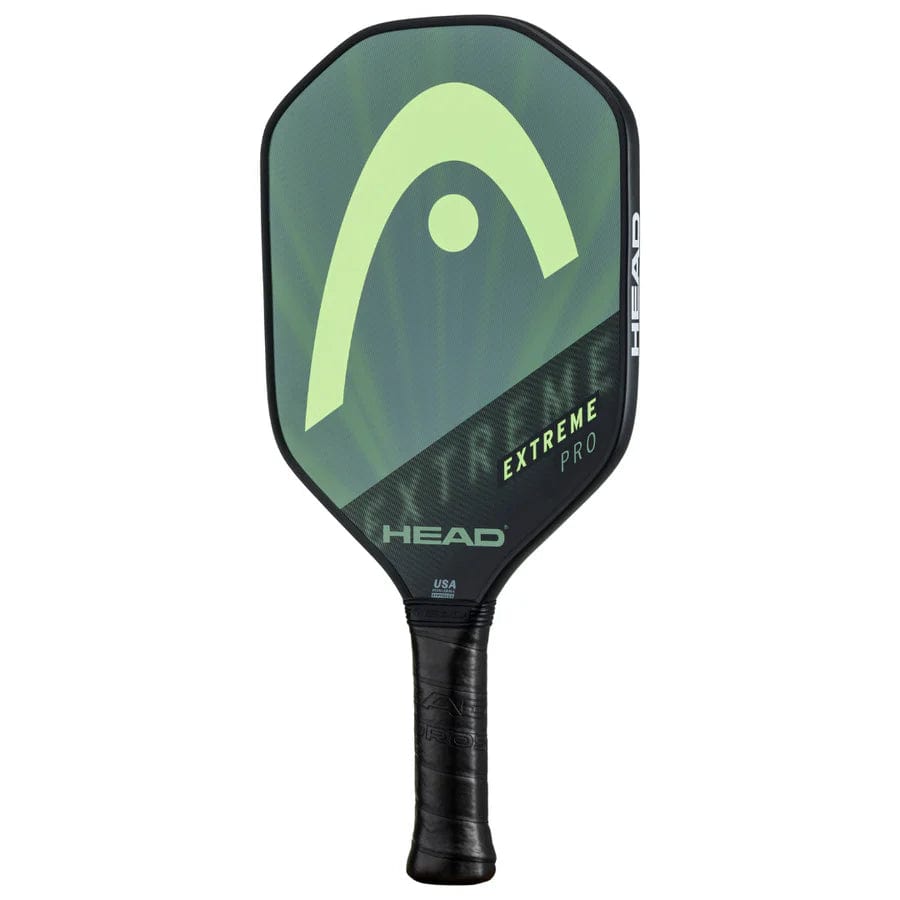 The HEAD Extreme Pro 2023 Pickleball Paddle by HEAD features a black Comfort Grip handle and a green-black composite surface with large HEAD logo and "EXTREME PRO" branding.
