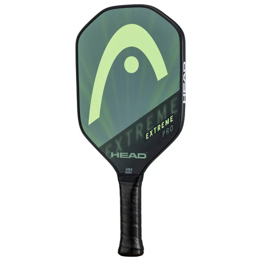 The HEAD Extreme Pro 2023 Pickleball Paddle by HEAD features a black Comfort Grip handle and a green-black composite surface with large HEAD logo and "EXTREME PRO" branding.