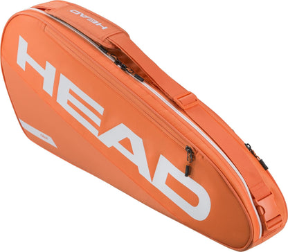 The HEAD Tour 3 Racket Tennis Bag S in orange features bold white HEAD branding, a zippered main compartment, and an adjustable shoulder strap—ideal for players needing a compact, stylish, and practical tennis bag.