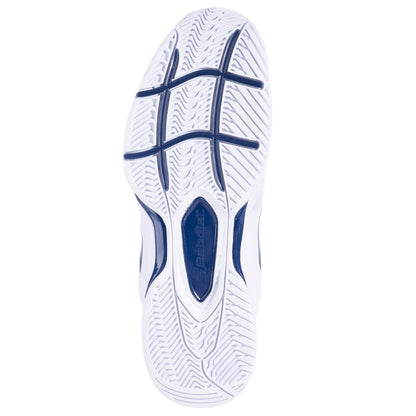 The image displays the sole of the Babolat SFX3 All Court Men's Tennis Shoes, showcasing a wavy tread pattern that is ideal for wide feet. It highlights blue accents and prominently features the word "Babolat" in the center. The design incorporates multiple grooves to provide traction and enhanced shock absorption.