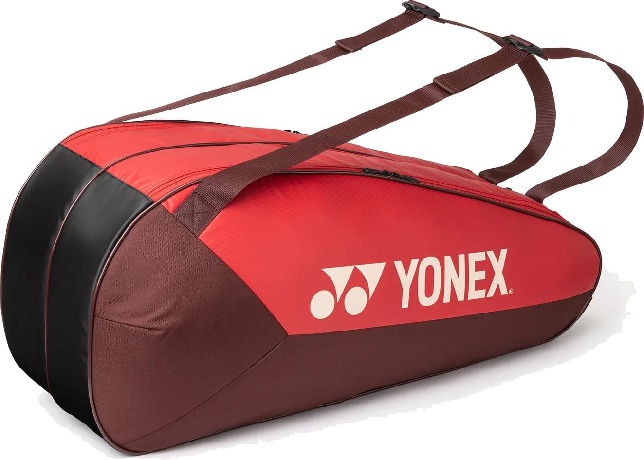 The Yonex 42526EX Team 6 Racket Tennis Bag in Ruby Red features two shoulder straps and the Yonex logo in white, offering spacious storage for rackets and sports gear.