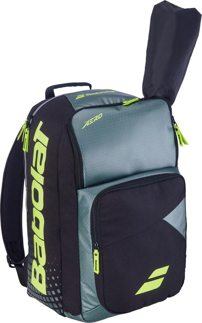 The Babolat Pure Aero 2026 Tennis Backpack by Babolat features a grey and yellow design, a roomy front pocket, and dedicated padded storage for your racket with a handle slot.