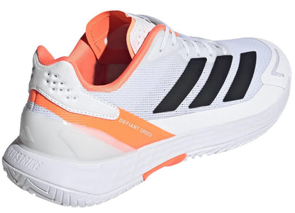 The adidas Defiant Speed 2 Men’s Tennis Shoes in white and orange feature black stripes, orange accents, "DEFIANT SPEED" on the side, a breathable mesh upper, lightweight feel, and a textured sole—ideal for athletic performance.