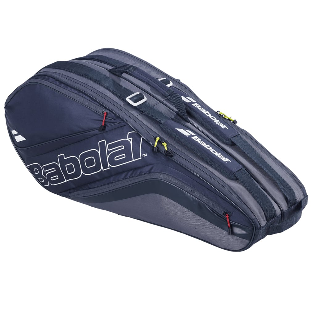 The Babolat Evo Court L Tennis Racket Bag in grey and blue, crafted from recycled material, includes multiple compartments and standout red zipper accents, providing a durable solution for transporting all your tennis gear.
