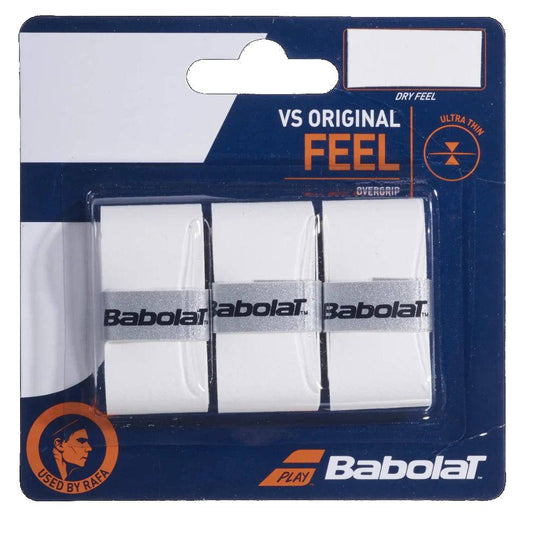 A pack of three Babolat VS Original X3 Tennis Overgrip in white offers comfort and excellent feel, featuring the Babolat brand name and "USED BY RAFA" text on the packaging.