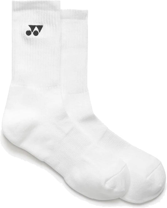 The Yonex 19256EX Sport Crew Tennis Socks - White (3 Pack) are plain, moisture-wicking crew socks with ribbed cuffs and a small black Yonex logo near the top, shown laid flat side by side on a white background.