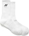 The Yonex 19256EX Sport Crew Tennis Socks - White (3 Pack) are plain, moisture-wicking crew socks with ribbed cuffs and a small black Yonex logo near the top, shown laid flat side by side on a white background.