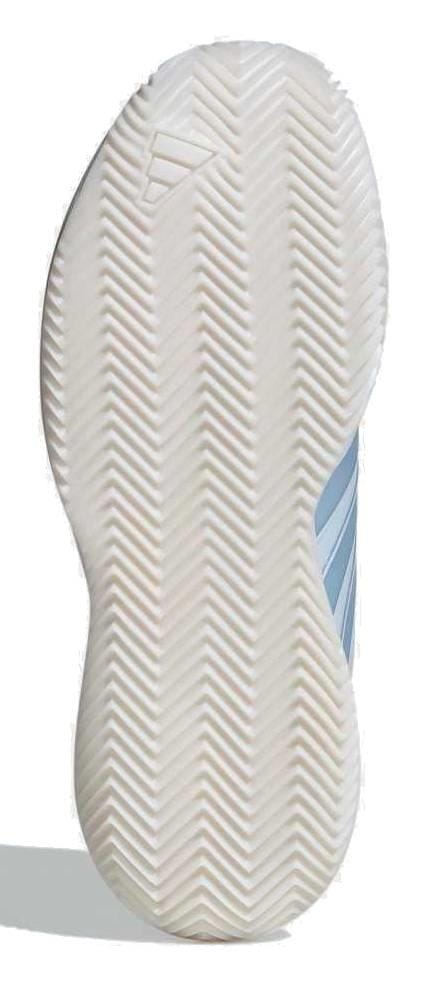 The image displays the sole of the adidas AvaFlash Women’s Tennis Shoes - Blue, featuring a white rubber herringbone traction pattern, an embossed logo, and light blue accents along the side of these lightweight shoes.