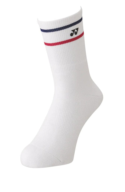 A Yonex 19172 Tennis Crew Sock in white, featuring a blue and red stripe near the top and adorned with the Yonex logo. This robust sock is showcased against a plain white background.