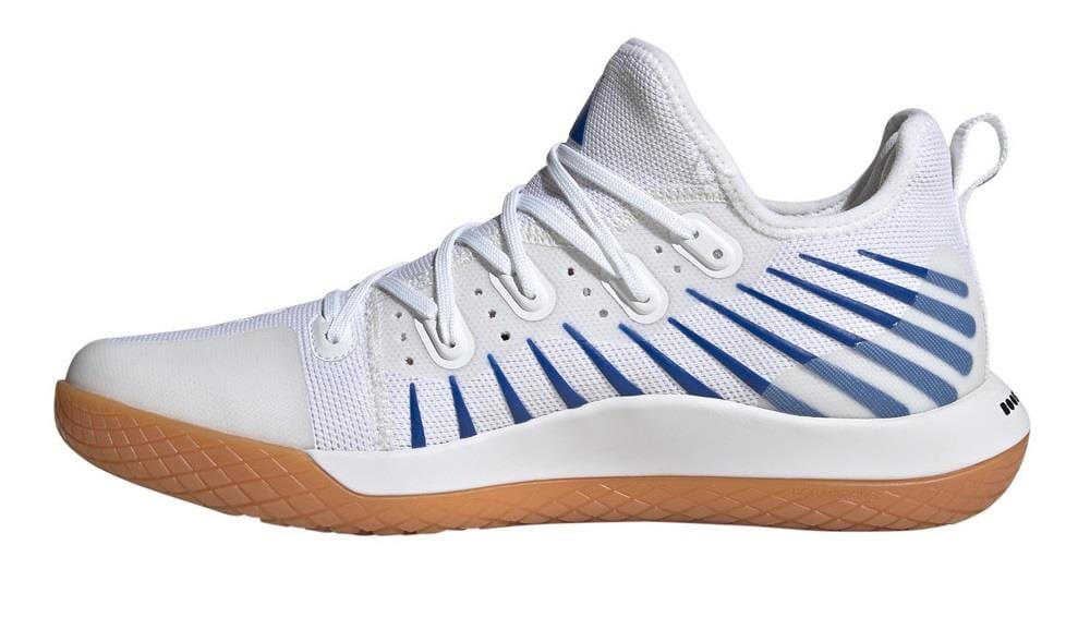 The ADIDAS Stabil Next Gen Primeblue Men's Indoor Shoes from adidas feature a cloud white color with core black accents, white laces, and a tan rubber sole. Designed for indoor courts, these shoes offer a sleek and modern high-ankle collar for optimal energy return during intense play.