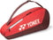 The Yonex 42523EX Team 3 Racket Tennis Bag in Ruby Red is a lightweight bag with a shoulder strap and zipper, fits up to 3 rackets, and features the Yonex logo and branding on the side.
