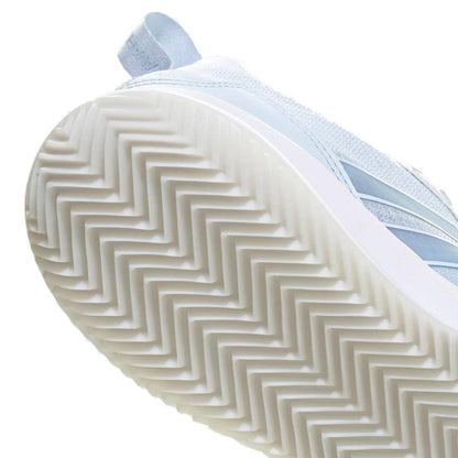 Close-up of the underside of the blue adidas ADIDAS AvaFlash Womens Tennis Shoes, highlighting a white rubber sole with a herringbone tread for enhanced grip.