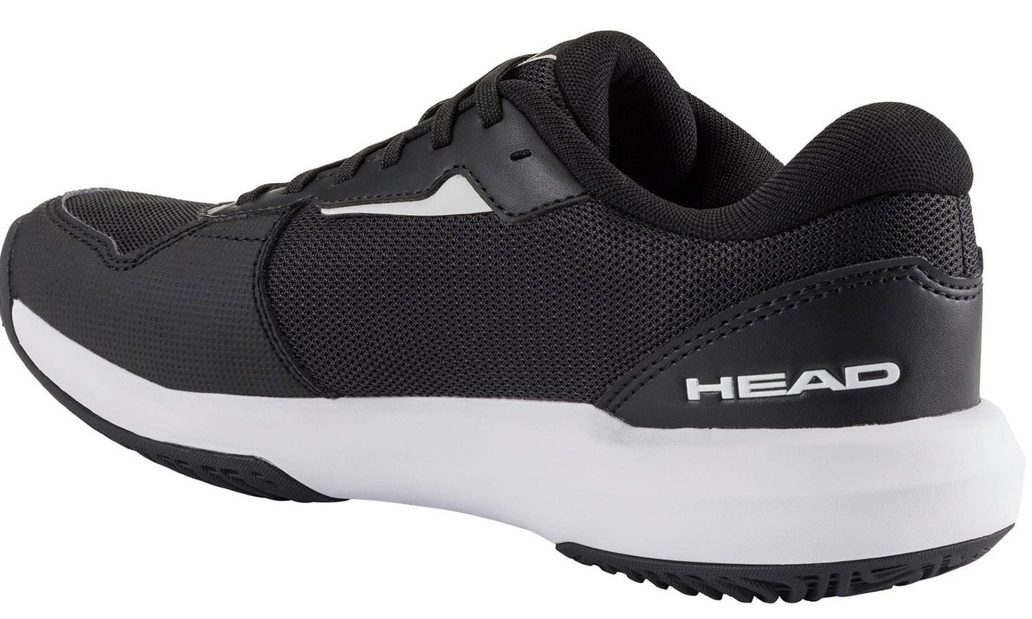 The HEAD Revolt Court 5.0 Womens Tennis Shoes in Black/White combine mesh and synthetic materials, displaying the HEAD logo on the heel—ideal for women seeking high-performance tennis footwear.