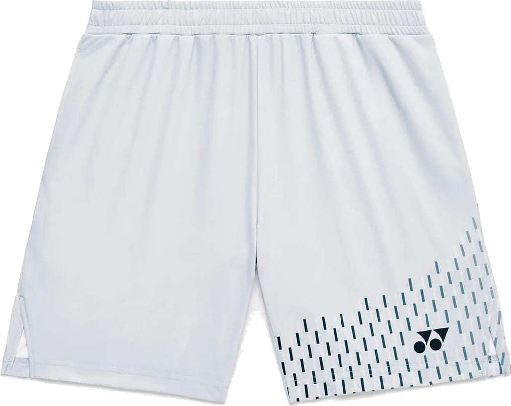 The Yonex 15241EX Knit Mens Tennis Shorts in Silver Grey feature an elastic waistband, a subtle pattern on the lower right leg, and a black Yonex logo. These moisture-wicking shorts keep you cool and comfortable on the court.
