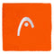The HEAD 2.5" Tennis Wristband in orange features a white embroidered arc and dot logo, offering both comfort and style on the court—ideal as a sweatband for tennis players.
