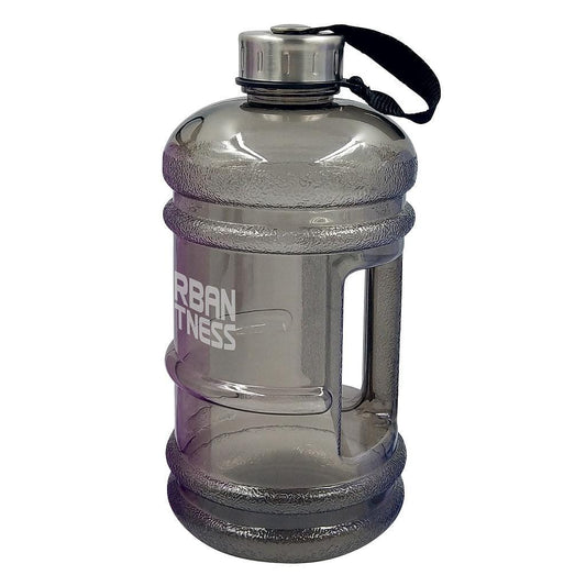 The Urban Fitness Quench 2.2L Water Bottle - Shadow is a large, gray, BPA-free hydration solution. It includes a screw-on cap with a black carrying strap and has a molded handle for easy grip. Its sturdy design makes it ideal for staying hydrated during workouts.