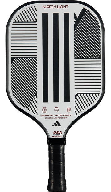 The adidas Match Light 3.3 Pickleball Paddle features a black and white geometric striped design, "MATCH LIGHT" label, fiberglass surface, black grip tape handle, and is USA Pickleball Approved.
