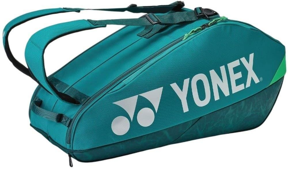 The Yonex 92426EX 6 Racket Pro Tennis Bag in dark green has two shoulder straps, a large zippered compartment, and a white Yonex logo on the side—ideal for carrying your tennis gear.