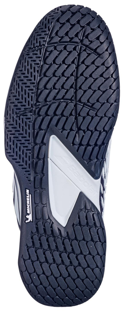The Babolat Propulse Fury 3 All Court Men's Tennis Shoes in Black/Illusion Blue feature a black, textured sole with zigzag and diamond tread, a white center section, and the Michelin logo for reliable grip on any court.