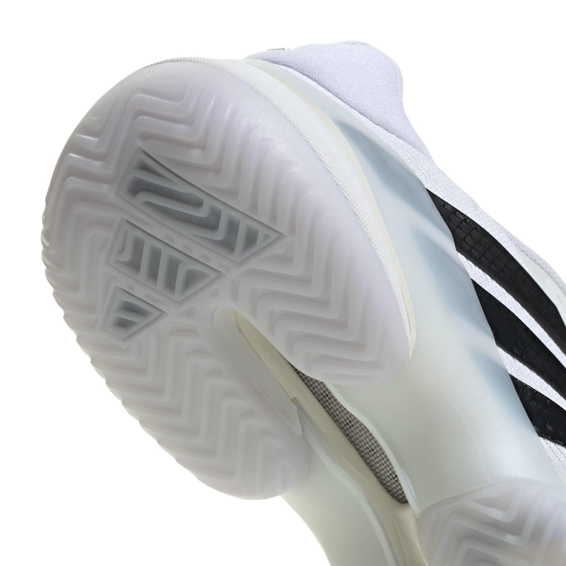 Close-up of the sole on adidas Barricade 14 Mens Tennis Shoes - White, highlighting the translucent, textured rubber outsole and herringbone tread for superior traction on court.