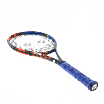 The Prince Beast Hydrogen Random 265g Tennis Racket, showcasing Textreme X Technology, displays a blue grip and a striking frame in shades of red, black, and blue. It is angled on a white background with strings forming the iconic Prince logo design.
