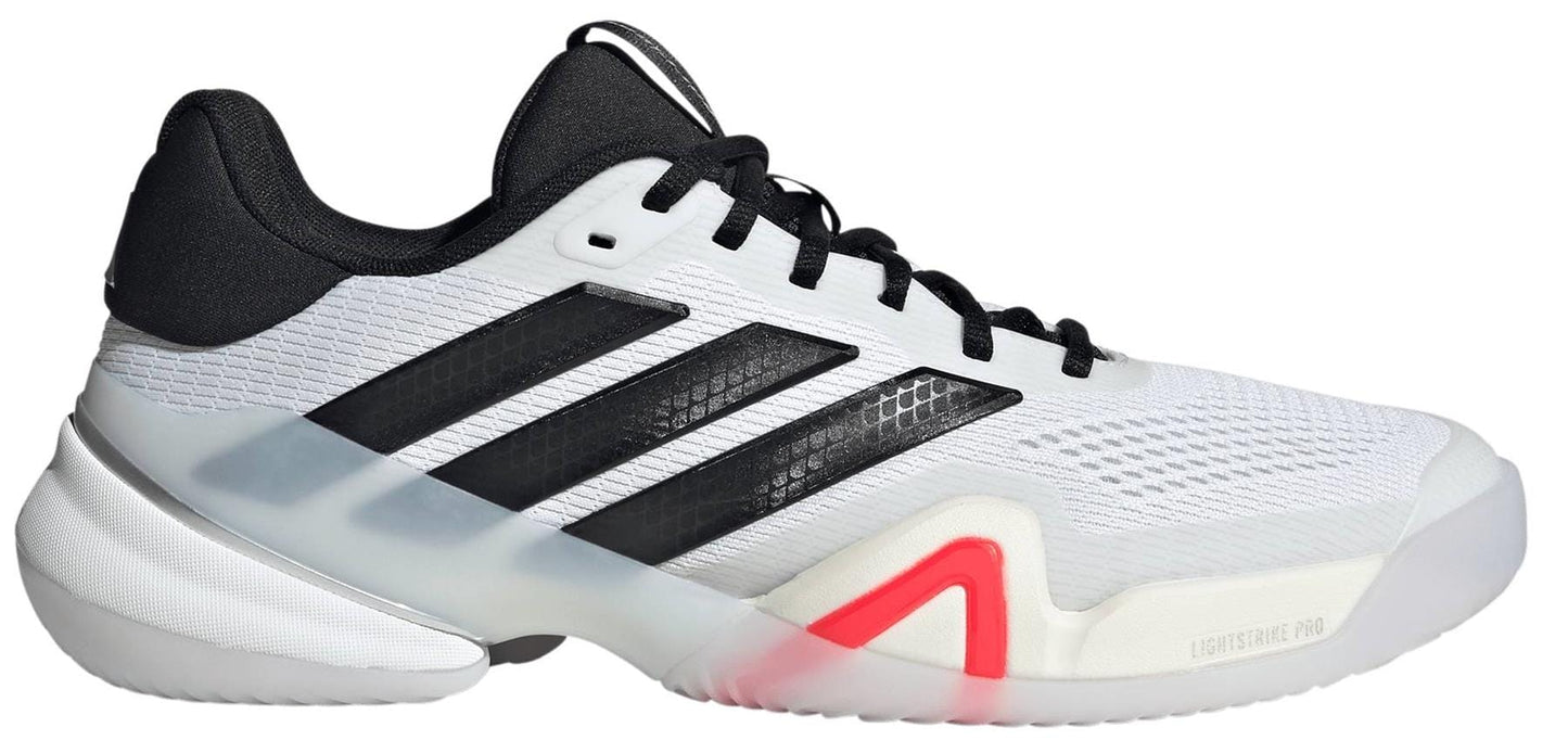 The adidas Barricade 14 Men's WIDE Tennis Shoes in white feature black laces, signature black stripes, a black heel, a touch of red near the midsole, and a mostly white hard-court sole with a translucent finish.