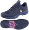 The Yonex Power Cushion Sonicage Wide Tennis Shoes in Dark Navy feature purple accents and a pink sole, shown from the side and bottom to highlight their tread—perfect for anyone seeking lightweight, comfortable tennis shoes.