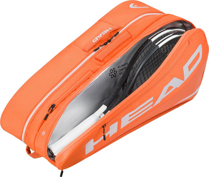 The HEAD Tour 9 Racket Tennis Bag L - Orange by HEAD features a large white logo and organized compartments, shown unzipped with two tennis racquets inside. This structured bag is perfect for carrying your essential tennis gear.