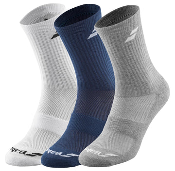The Babolat Long 3 Pack Tennis Socks are presented in three colors: white, dark blue, and light gray. Each sock includes a ribbed texture at the calf and a logo placed near the ankle. These socks are crafted for optimal comfort and support, featuring ventilated zones to enhance breathability. They stand upright side by side for display.