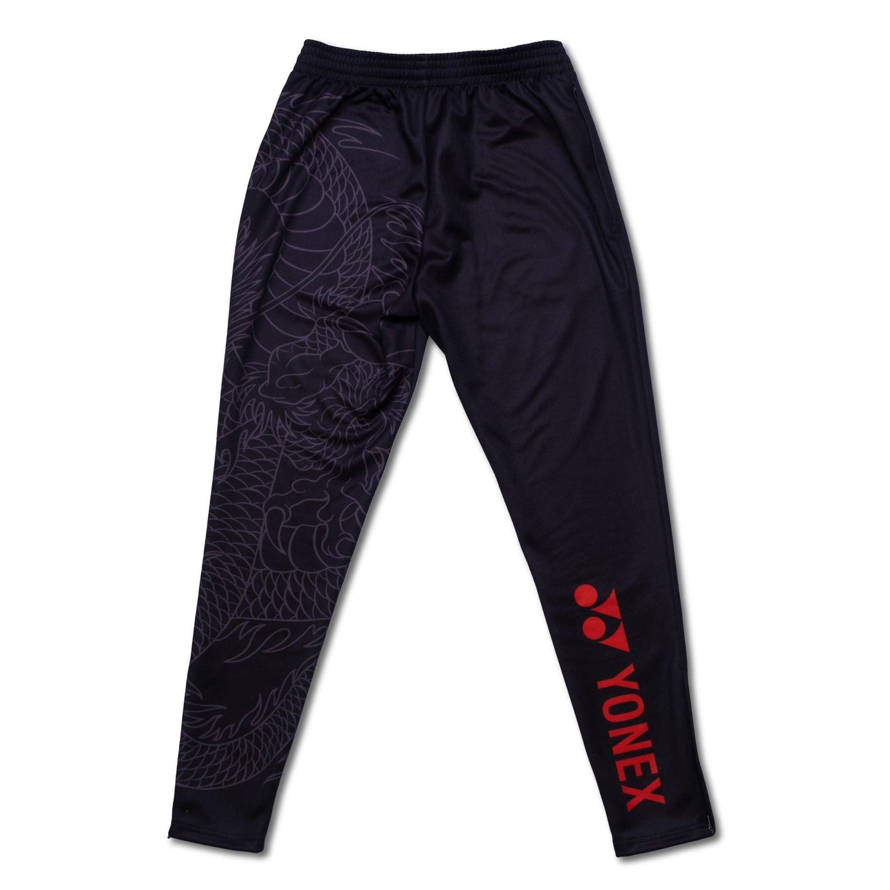 The Yonex CNY2024 Linear Dragon Unisex Tennis Tracksuit Pants in black feature a subtle linear dragon design on one leg and proudly display "Yonex CNY2024" in bold red print on the other. With an elastic waistband for added comfort, these pants are ideal for both athletic activities and casual wear.