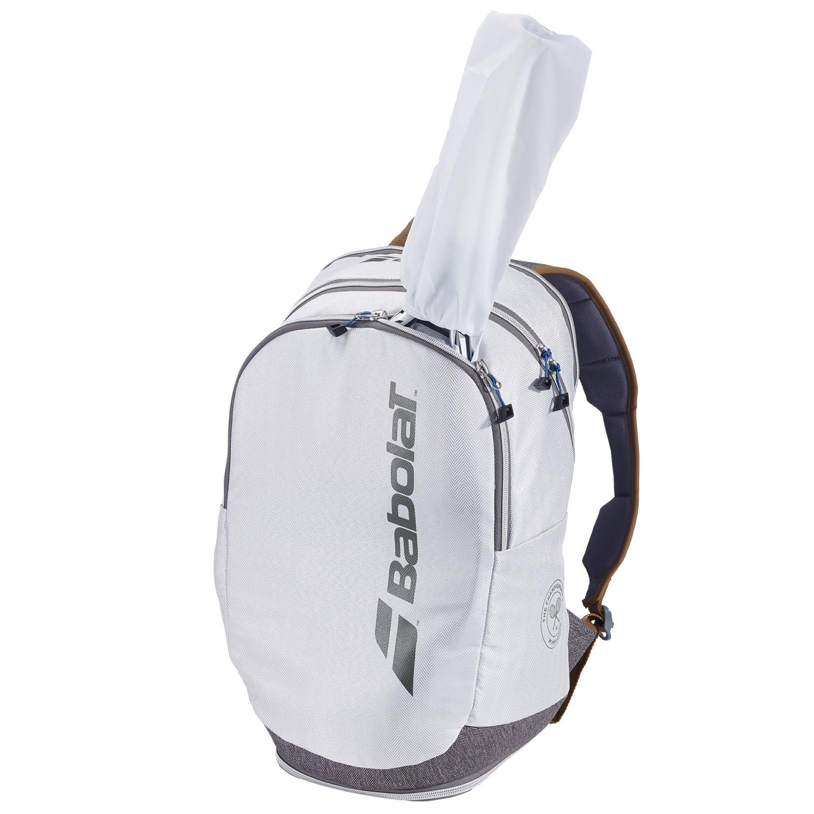 A grey Babolat Wimbledon Court Tennis Backpack, crafted from recycled materials, features a zippered main compartment and a side pocket. The spacious design conveniently accommodates a racquet handle protruding from the top.