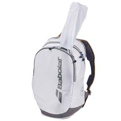 A grey Babolat Wimbledon Court Tennis Backpack, crafted from recycled materials, features a zippered main compartment and a side pocket. The spacious design conveniently accommodates a racquet handle protruding from the top.