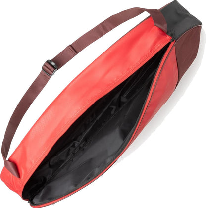 The Yonex 42523EX Team 3 Racket Tennis Bag in Ruby Red has a spacious black interior, lightweight design, and an adjustable brown shoulder strap for comfortable carrying.